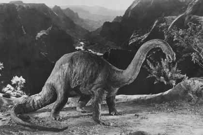A Brontosaurus stands on a mountain in The Lost World (1924)