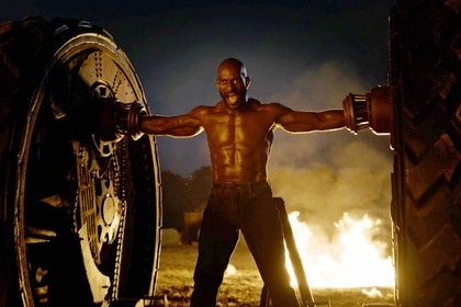 Axel screaming with his arms wide open in Twisted Metal Season 2, Episode 3.
