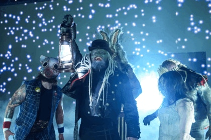 Uncle Howdy leading the Wyatt Sicks with a lantern
