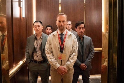 Hutch Mansell (Bob Odenkirk) stands in an elevator with men on Nobody 2 (2025).