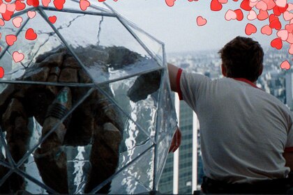 Ryan Gosling as Ryland Grace next to alien Rocky in Project Hail Mary with added heart emojis around the border