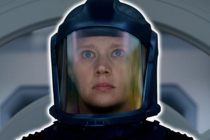 Kate McKinnon wearing a spacesuit and look awestruck in In the Blink of an Eye.