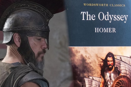 LEFT: Matt Damon in The Odyssey, RIGHT: a copy of the Odyssey book.