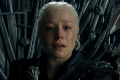 Rhaenyra Targaryen (Emma D'Arcy) sitting on the Iron Throne in House of the Dragon.