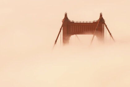 The Golden Gate Bridge almost lost in fog flowing in from the Pacific Ocean. Taken from the video “Adrift”. 