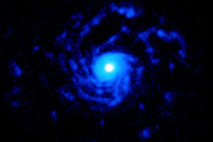 The very young star RU Lupi is surrounded by vast spiral arms of cold carbon monoxide gas that extends for 150 billion km from the star. Credit: ALMA (ESO/NAOJ/NRAO), J. Huang and S. Andrews; NRAO/AUI/NSF, S. Dagnello