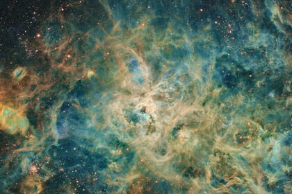 The Tarantula Nebula is a sprawling gas cloud in the Large Magellanic Cloud, and one of the largest star-forming regions in the local Universe. Credit: Jean Claude Canonne, Philippe Bernhard, Didier Chaplain, Nicolas Outters, and Laurent Bourgon