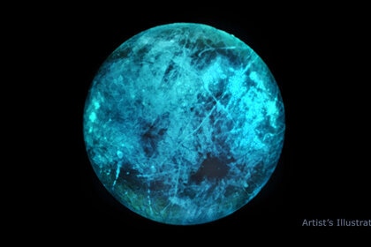 The dark side of Europa may glow a lovely shade of teal, as shown in this artwork, due to radiation bombarding salty ice on its surface. Credit: NASA/JPL-Caltech