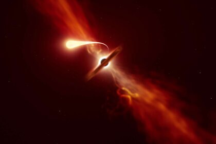 Artwork depicting a tidal disruption event, when a star is torn apart by a black hole. A stream of matter is puller off, forming a disk around the black hole and creating an outflow of high-speed material. Credit: ESO/M. Kornmesser