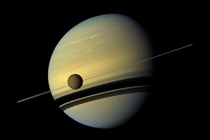 The giant moon Titan in front of Saturn's edge-on rings, seen by the Cassini spacecraft in 2012. Credit: NASA/JPL-Caltech/Space Science Institute