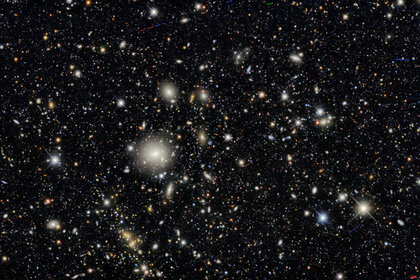 The galaxy cluster WHL J095921.0+011752, at a distance of about 1.5 billion light years from Earth, was one of many clusters examined in the Dark Energy Survey. Almost everything in this image is a distant galaxy. 