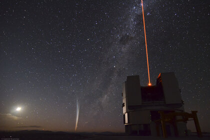 Comet Lovejoy with the Very Large Telescope (firing a laser into the sky to help it focus better on stars). Credit: ESO/ G. Brammer