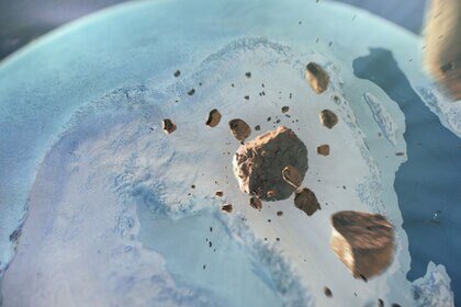 Incoming! Somewhat fanciful artwork depicting the asteroid responsible for the Hiawatha impact crater asteroid breaking up high above the Earth before slamming into Greenland. Credit: Natural History Museum of Denmark, Cryospheric Sciences Lab, NASA/GSFC