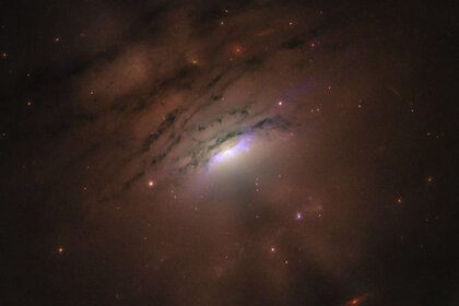 IC 5063 is an active galaxy where shadows tens of thousands of light years long are being cast from the center. Credit: NASA, ESA, STScI and W. P . Maksym (CfA)