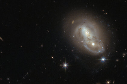 The galaxies collectively known as IRAS 06076-2139 are weakly interacting, but they’ve had an exciting past. Credit: ESA/Hubble & NASA