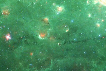 "Nessie", the dark filament running along the bottom 1/3 of this image, is an immense cloud of cold gas and dust. Credit: NASA/JPL/SSC