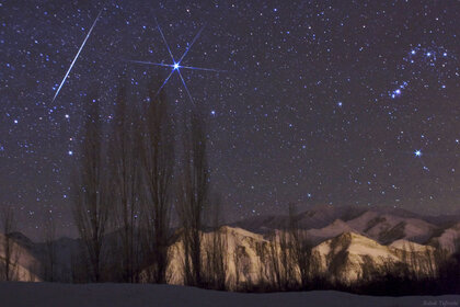 A bright Geminid streaks past Orion and the bright star Sirius in the 2009 shower. Credit: Babak Tafreshi