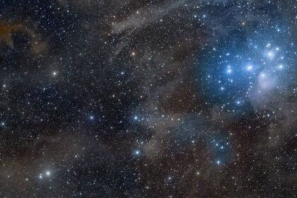 The Pleiades and galactic cirrus. Credit: Rogelio Bernal Andreo