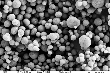 Tholin analogues created in a lab to mimic Titan’s haze particles. The scalebar on the left is 1 micron, one-millionth of a meter. Credit Nathalie Carrasco (CC BY-ND 2.0)
