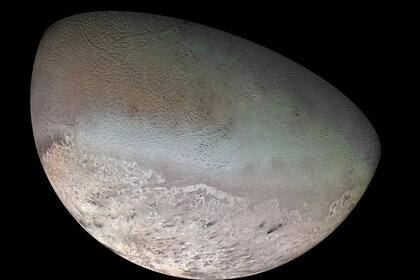 A mosaic of Neptune’s moon Triton created from Voyager 2 images during a flyby in 1989. Note the black streaks near the bottom; evidence of geyser-like eruptions and wind. Credit: NASA/JPL/USGS