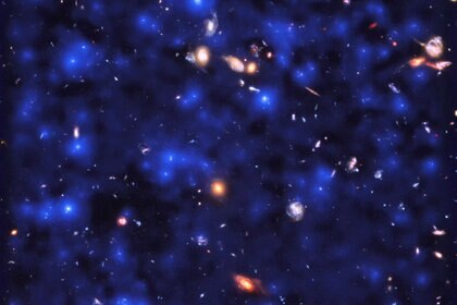 A section of the Hubble Ultra Deep Field showing hundreds of galaxies, with the MUSE observations of hydrogen glow superposed (blue). The glow is everywhere, coming from hydrogen gas in the distant Universe. ESA/Hubble & NASA, ESO/ Lutz Wisotzki et al.