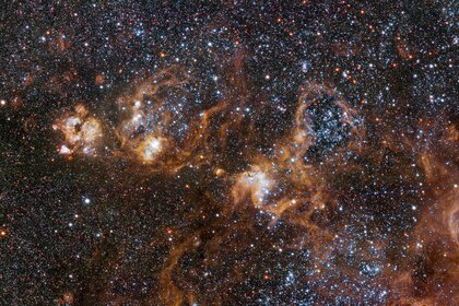 vlt_tarantula_heroThe hugely sprawling Tarantula Nebula, a vast star-forming complex in a nearby satellite galaxy of the Milky Way. Credit: ESO