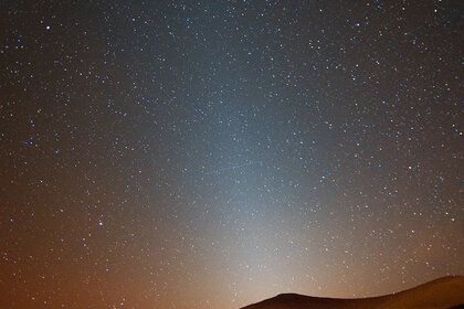 Zodiacal light, sunlight reflected off the scattered remains of thousands of long-dead comets. Credit: Rogelio Bernal Andreo
