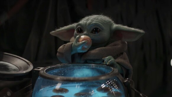 Baby Yoda eating eggs in The Mandalorian