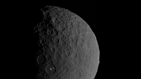 Half-full view of Ceres from the Dawn spacecraft highlighting the crater Occitor