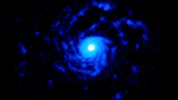 The very young star RU Lupi is surrounded by vast spiral arms of cold carbon monoxide gas that extends for 150 billion km from the star. Credit: ALMA (ESO/NAOJ/NRAO), J. Huang and S. Andrews; NRAO/AUI/NSF, S. Dagnello