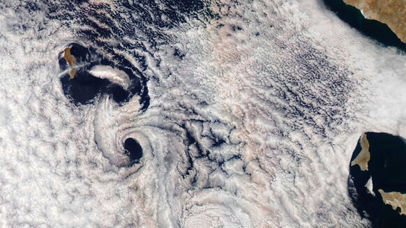Guadalupe Islands spawns vortices downwind as weird effects stretch a glory out into a pair of parallel lines. Credit: NASA Earth Observatory image by Joshua Stevens, using MODIS data from LANCE/EOSDIS Rapid Response