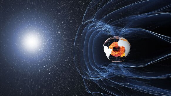 The Earth’s magnetic field acts like a shield, protecting us from subatomic particles form the Sun. Credit: ESA