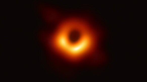 The very first image of the "shadow" of a supermassive black hole. This shows the region around a black hole with a mass 6.5 billion times that of the Sun, located 55 million light years away from Earth in the core of the galaxy M87. Credit: NSF