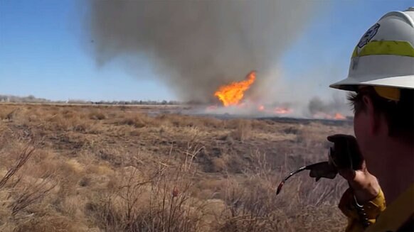 A fire tornado (really a fire dust devil) forms during a proscribed burn in Denver, Colorado in 2014. Credit: Thomas Rogers, from the video