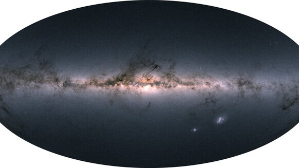 The entire sky — 1.7 billion stars’ worth — mapped by Gaia and displayed using color information also obtained by the satellite. You can see we live in a flat galaxy with a large central bulge, festooned with dark filaments of dust. Credit: Gaia/DPAC/ESA