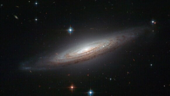 The dusty spiral galaxy NGC 634, imaged by the Hubble Space Telescope. Credit: ESA/Hubble & NASA