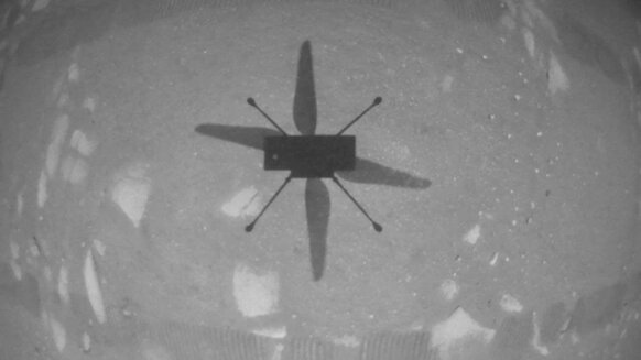 The Mars helicopter Ingenuity sees its own shadow on the surface of Mars using a downward-facing camera as it hovered. Credit: NASA/JPL-Caltech