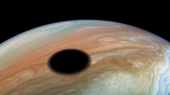 The shadow of Jupiter’s moon Io on its cloud tops. Credit: NASA/JPL-Caltech/SwRI/MSSS/Kevin M. Gill