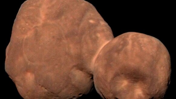 A color image of Arrokoth shows it is very red and smooth. The biggest crater, Maryland, can be seen on the small lobe. Credit: ASA/Johns Hopkins University Applied Physics Laboratory/Southwest Research Institute