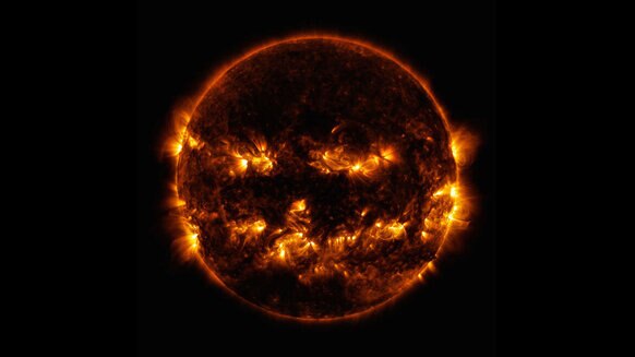 The Sun as seen by the Solar Dynamics Observatory in extreme ultraviolet (17.1 and 19.3 nanometers) makes it look like a pumpkin; magnetic activity was near its peak at the time. Credit: NASA/GSFC/SDO