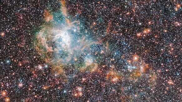 The Tarantula Nebula in infrared isn’t quite as showy as it is in visible light, but it’s still impressive.  Credit: ESO/VMC Survey