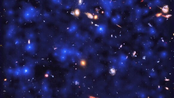 A section of the Hubble Ultra Deep Field showing hundreds of galaxies, with the MUSE observations of hydrogen glow superposed (blue). The glow is everywhere, coming from hydrogen gas in the distant Universe. ESA/Hubble & NASA, ESO/ Lutz Wisotzki et al.