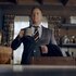 Harry Vanderspeigle wears a suit and holds a mug in Resident Alien Episode 301.