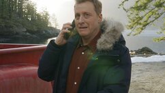 Harry Vanderspeigle speaks on a cellphone in Resident Alien Episode 302.