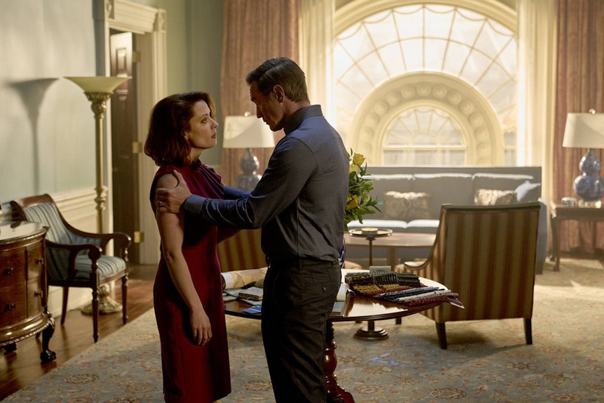 James Collins (Devon Sawa) holds Charlotte Colins (Lara Jean Chorostecki) in a well lit room in Chucky 301.