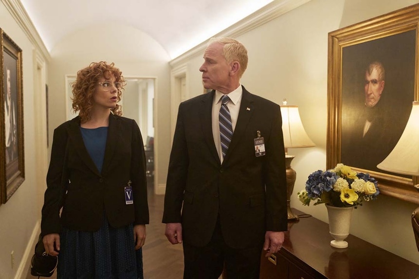 Miss Fairchild (Annie Briggs) and a man speak in the White House hallway in Chucky 302 -- “Let the Right One In”