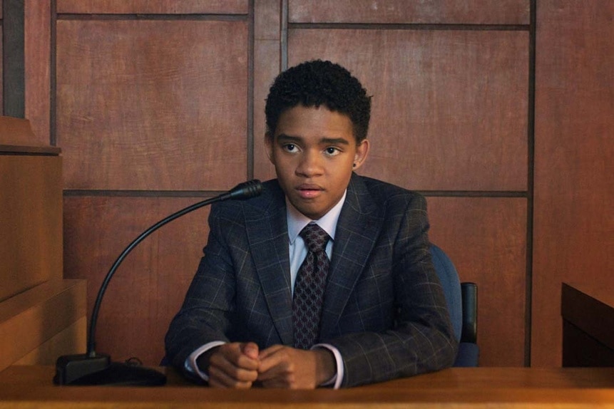 Devon Evans (Bjorgvin Arnarson) frowns in a witness stand in court in Chucky 303.