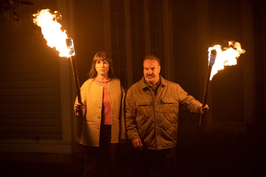 Renata Massey (Geneviève Steel) and Rowan Massey (Tony Nappo) hold firey torches in SurrealEstate 206.