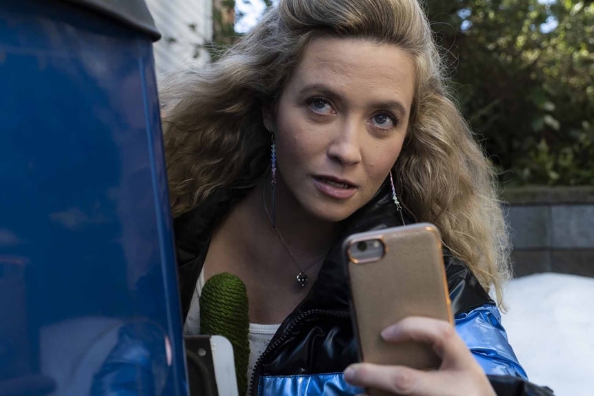 Judy Cooper (Jenna Lamia) records with a phone in Resident Alien episode 306.