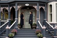 (l-r) Megan Donovan (Tennille Read) and Luke Roman (Tim Rozon) speak on a porch in SurrealEstate 201 "Trust the Process".